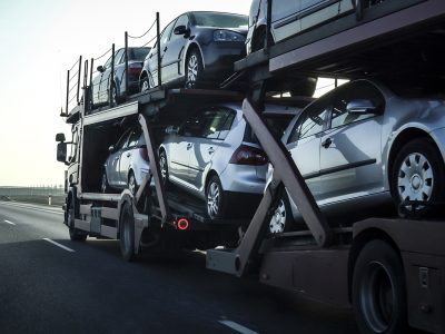 car-transporter-trailer-loaded-with-many-cars-highway-motion-blur-effect car-transporter-trailer-loaded-with-many-cars-highway-motion-blur-effect