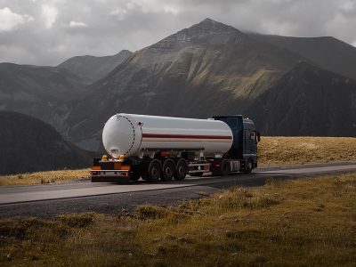 freight truck on the mountain pass road fuel tanker truck on the mountain road